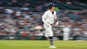 Detroit Tigers' Zach McKinstry runs to first during the seventh inning of a baseball game against the Chicago White Sox, Friday, May 26, 2023, in Detroit. (AP Photo/Carlos Osorio)