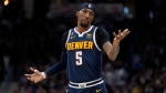 Denver Nuggets guard Kentavious Caldwell-Pope (5) looks towards his bench during the first half of Game 2 of the NBA basketball Western Conference Finals series against the Los Angeles Lakers, Thursday, May 18, 2023, in Denver. (AP Photo/Jack Dempsey)