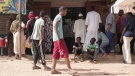 People line up in front of a bakery during a cease-fire in Khartoum, Sudan, Saturday, May 27, 2023. (AP Photo/Marwan Ali)