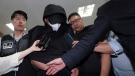 A man who opened an emergency exit door during a flight, arrives to attend an arrest warrant review at the Daegu District Court in Daegu, South Korea, Sunday, May 28, 2023. (Yun Kwan-shick/Yonhap via AP)