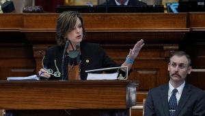 Rep. Andrew Murr, R - Junction, Chair of the House General Investigating Committee, right, listens as Rep. Ann Johnson, D - Houston, Vice Chair, speaks during the impeachment proceedings against state Attorney General Ken Paxton in the House Chamber at the Texas Capitol in Austin, Texas, Saturday, May 27, 2023. (AP Photo/Eric Gay)