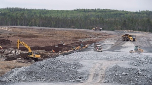 In this file photo, workers construct a dam for the tailings pond at Atlantic Gold Corporation's Touquoy open pit gold mine in Moose River Gold Mines, N.S. on Tuesday, June 6, 2017. THE CANADIAN PRESS/Andrew Vaughan