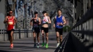 Elite racers make their way across the Alexandra Bridge during the marathon of the Ottawa Race Weekend in Ottawa, on Sunday, May 28, 2023. (Justin Tang/THE CANADIAN PRESS)