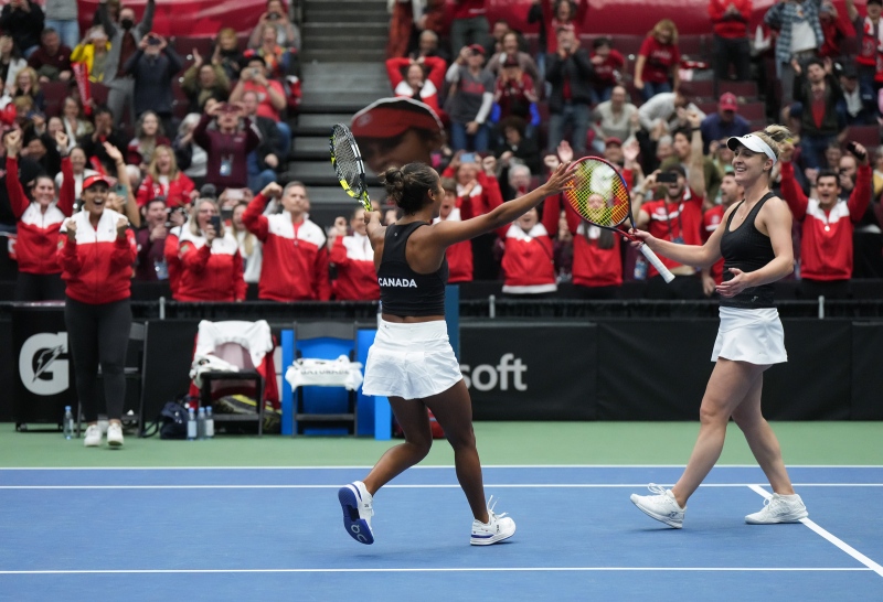 Canada's Gabriela Dabrowski, right, and Leylah Fernandez celebrate after defeating Belgium's Kirsten Flipkens and Greet Minnen during a Billie Jean King Cup qualifiers doubles match, in Vancouver, on Saturday, April 15, 2023. Canada won three of the five matches to win the qualifying tie and advance to the 2023 Billie Jean King Cup finals. THE CANADIAN PRESS/Darryl Dyck