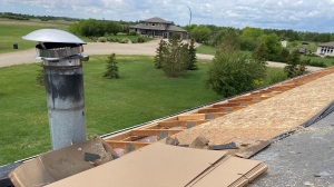 A home near White City was left with some roof repairs following the tornado touchdown south of Regina on May 27, 2023. (Gareth Dillistone/CTV News)