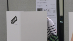 A person fills out their ballot in the 2023 Alberta election on May 29, 2023. 