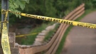 Police tape is shown near the scene of where a fetus was discovered in an Oakville, Ont. park on May 19, 2023.