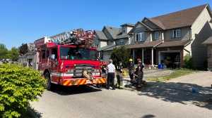 Waterloo firefighters are seen on scene of a house fire on May 29, 2023. (Heather Senoran/CTV News)