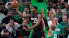 Miami Heat forward Jimmy Butler, left, passes while under pressure from Boston Celtics center Al Horford during the first half in Game 7 of the NBA basketball Eastern Conference finals Monday, May 29, 2023, in Boston. (AP Photo/Charles Krupa )