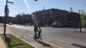 A cyclist takes a bike path in Montreal. The city continues to expand its network with hopes of adding 200 kilomtres of paths by 2027. (Scott Prouse/CTV News)