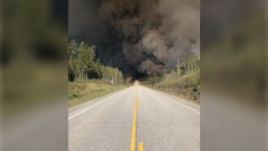 Thick smoke from an out of control forest fire hangs above Highway 631 near White River. May 29/23 (Ontario Provincial Police)