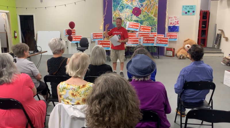 Peter Bergmanis, co-chair of the London Health Coalition addresses a crowd on May 30, 2023 as he reveals the results from the recent survey on public health care. (Brent lale/CTV News London)
