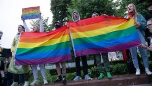 LGBTQ activists wave rainbow-coloured flags during a rally in Moscow, Russia, Wednesday, July 15, 2020. (AP Photo, File) 