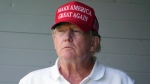 Former President Donald Trump watches the first round of the LIV Golf Tournament at Trump National Golf Club, Friday, May 26, 2023, in Sterling, Va. When Republican Sen. Tim Scott launched his campaign for the White House last week, Trump welcomed his new competitor with open arms. (AP Photo/Alex Brandon, File)