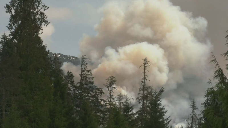 Wildfire burns out of control near island village