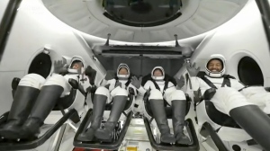 In this image taken from video broadcast by SpaceX, crew members wave after the SpaceX Dragon capsule splashed down into the Gulf of Mexico, just off the Florida Panhandle, late Tuesday, May 30, 2023. The private flight carrying two Saudi astronauts and other passengers returned to Earth after a nine-day trip to the International Space Station. (SpaceX via AP)