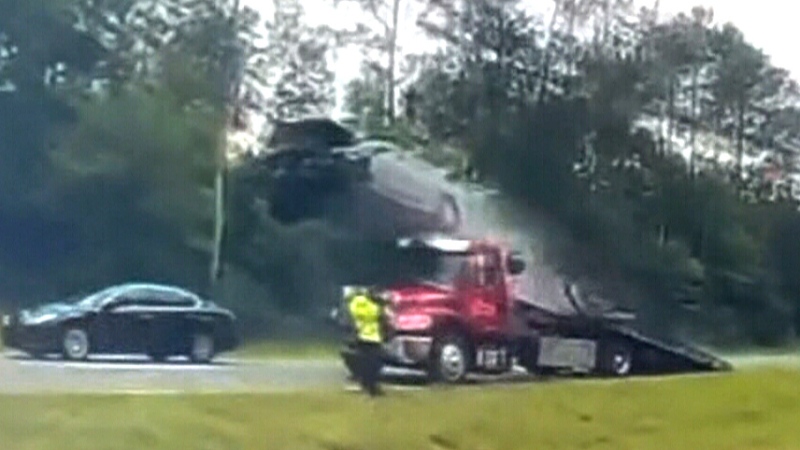 Car flips in the air at scene of highway crash