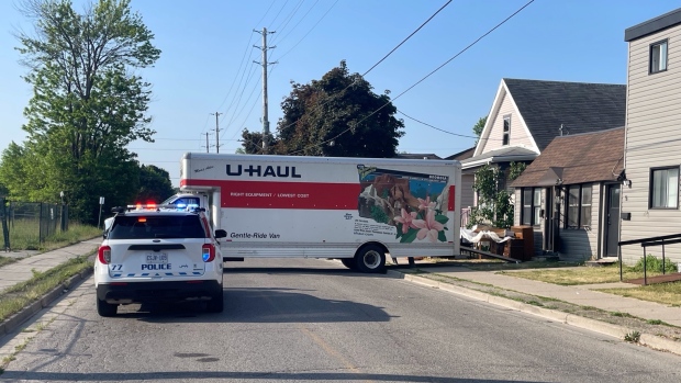 Police are investigating in the area surrounding a moving van after an incident Wednesday morning near Grey and Maitland streets. May 31, 2023. (Sean Irvine/CTV News London)