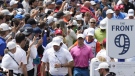 Rory McIIroy (pink shirt) makes his way through the crowd on his way to the second green during the fourth round of the Canadian Open in Toronto, June 12, 2022. THE CANADIAN PRESS/Frank Gunn