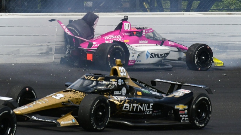 Simon Pagenaud, of France, hits the wall in the third turn during the Indianapolis 500 auto race at Indianapolis Motor Speedway in Indianapolis, Sunday, May 28, 2023. (AP Photo/James Miller)
