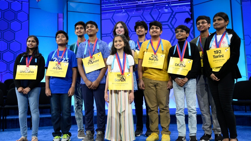 The 11 finalists for the Scripps National Spelling Bee pose for a picture after the day's competition, Wednesday, May 31, 2023, in Oxon Hill, Md. Left to right-Shradha Rachamreddy, 13, from San Jose, Calif., Aryan Khedkar, 12, from Rochester, Hills Mich., Arth Dalsania, 14, from Camarillo, Calif., Pranav Anandh, 14, from Glen Mills, Pa., Sarah Fernandes, 11, from Omaha, Neb., Charlotte Walsh, 14, from Arlington, Va., Dev Shah, 14, from Largo, Fla., Surya Kapu, 14, from South Jordan, Utah, Dhruv Subramanian, 12, from San Ramon, Calif., Vikrant Chintanaboina, 14, from San Jose, Calif., and Tarini Nandakumar, 12, from Round Rock, Texas. (AP Photo/Nick Wass)