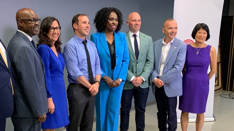 The leading mayoral candidates pose with debate organizers following a debate at the Ted Rpogers School of Management in downtown Toronto Wednesday May 31, 2023. (Joshua Freeman /CP24) 