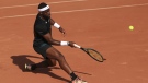Frances Tiafoe of the U.S. plays a shot against Serbia's Filip Krajinovic during their first round match of the French Open tennis tournament at the Roland Garros stadium in Paris, May 29, 2023. The group that runs the French Open tennis tournament has hired an artificial intelligence company to monitor players' social media accounts in a bid to try to protect athletes from cyberbullying. (AP Photo/Aurelien Morissard, File)