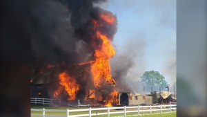 Emergency crews work to battle a barn fire in Delaware, Ont. on June 1, 2023. (Source: OPP)