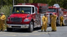 Firefighters arrive at a command centre within the evacuated zone while taking a break from battling the wildfire burning in Tantallon, N.S. outside of Halifax on Wednesday, May 31, 2023. (THE CANADIAN PRESS/Darren Calabrese)