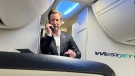 WestJet CEO Alexis von Hoensbroech speaks to passengers on a flight in Toronto. (Supplied by Darren Dreger)