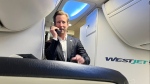 WestJet CEO Alexis von Hoensbroech speaks to passengers on a flight in Toronto. (Supplied by Darren Dreger)