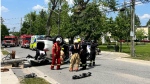 A vehicle flipped onto its roof and a hydro pole snapped onto the road following a collision in Bracebridge, Ont., on Thurs., June 1, 2023. (OPP)
