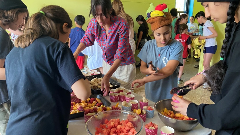 Teacher Ann LeBrasseur with her grade six students making sorbet at École Gentilly in Dorval.