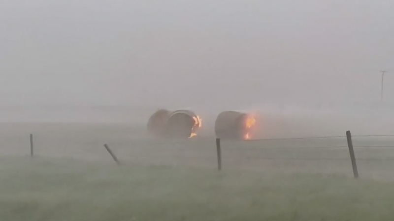 Hay bales on fire after lightning strike