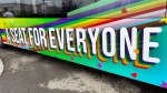 The City of Leduc unveiled a new Pride-themed bus wrap at a flag raising ceremony Thursday. (Sean McClune/CTV News Edmonton)