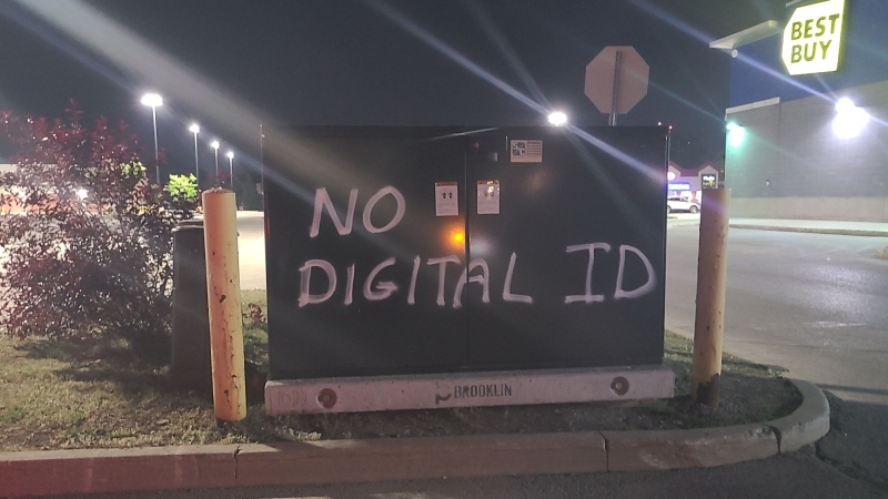 Town property is spray-painted with the words 'No digital ID' in Orangeville, Ont. (OPP)