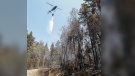 Water is dropped on a wildfire hotspot near Tantallon. (Communications Nova Scotia)
