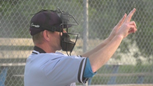 Conrad Walpot, Zone 10 umpire in chief, yells out the pitch count during a men's league baseball game between Lyn and Easton's Corners. (Nate Vandermeer/CTV News Ottawa)