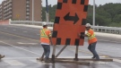 Crews remove signage from the redeveloped Anne Street bridge in Barrie, Ont., on Fri., June 2, 2023. (CTV News/Rob Cooper)
