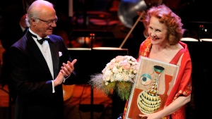 Polar Music Prize laureate composer Kaija Saariaho, of Finland, receives the Polar Music Prize 2013 from King Carl Gustaf, left, at the prize-ceremony in Stockholm Concert Hall in Stockholm, on Aug. 27, 2013. (Erik Martensson/TT News Agency via AP, File)