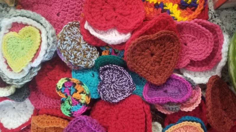 Handmade hearts will line the chain link fences between the Autumn Grove Seniors Lodge and the hospital in Innisfail, Alta., on Saturday. It's called the Crochet Heart Bomb Project.