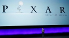 Tony Chambers, the head of theatrical distribution for Disney Entertainment, addresses the audience underneath a Pixar Animation Studios logo during the Walt Disney Studios presentation at CinemaCon 2023, the official convention of the National Association of Theatre Owners at Caesars Palace, April 26, 2023, in Las Vegas. (AP Photo/Chris Pizzello)
