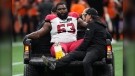Calgary Stampeders' Derek Dennis is driven off the field with an injury during the first half of CFL football game against the B.C. Lions in Vancouver, on Saturday, September 24, 2022. Dennis was one of 22 players released by the Stampeders Saturday. THE CANADIAN PRESS/Darryl Dyck