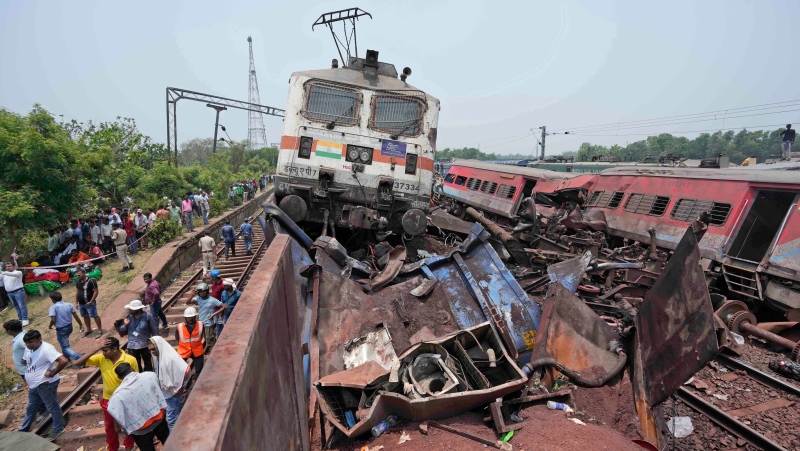 Rescuers work at the site of passenger trains that derailed in Balasore district, in the eastern Indian state of Orissa, Saturday, June 3, 2023. (AP Photo/Rafiq Maqbool)