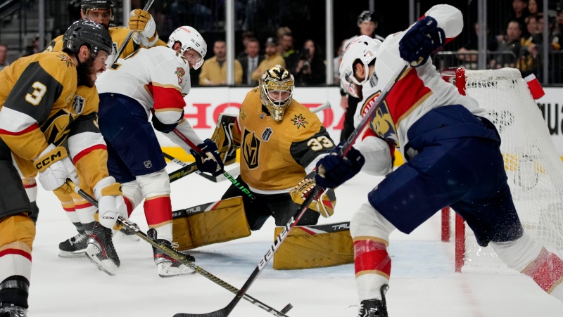 Vegas Golden Knights goaltender Adin Hill (33) defends against the Florida Panthers during the third period of Game 1 of the NHL hockey Stanley Cup Finals, Saturday, June 3, 2023, in Las Vegas. The Golden Knights defeated the Panthers 5-2. (AP Photo/John Locher)
