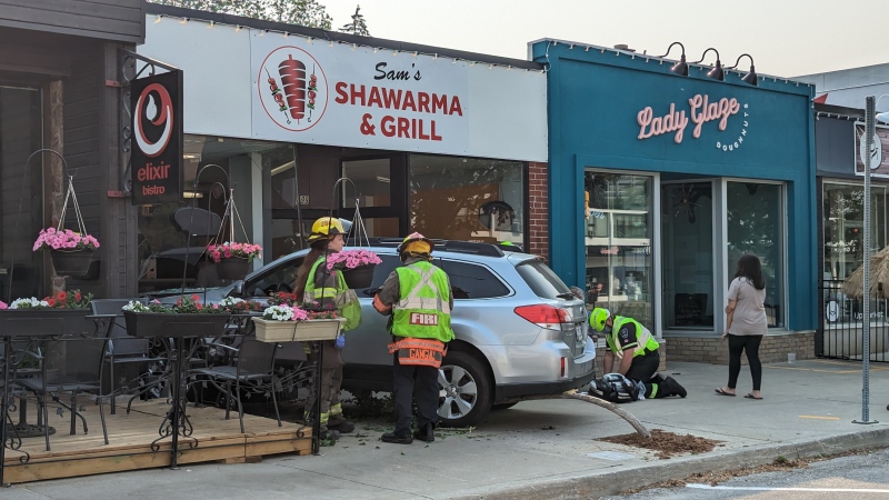 A vehicle sits on the sidewalk on June 4 in Kitchener with damage to a business in Kitchener. (Dan Lauckner/CTV News)