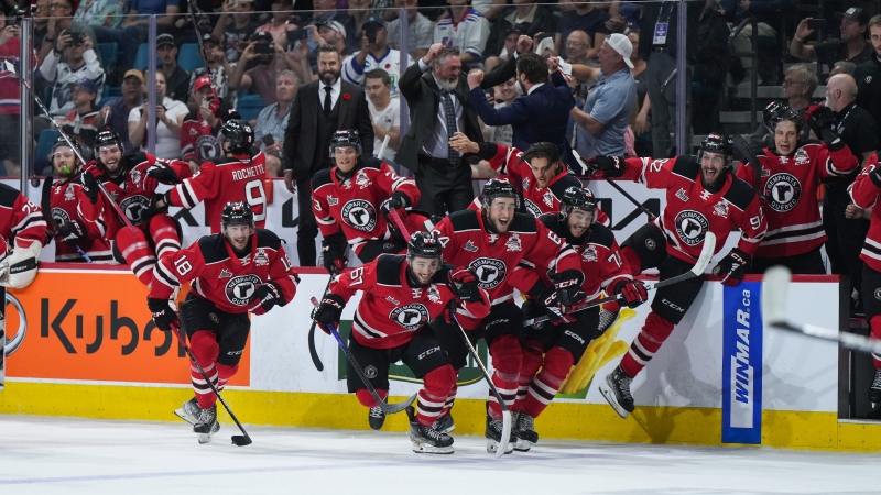 Quebec Remparts players and coaching staff celebrate after Quebec defeated the Seattle Thunderbirds during Memorial Cup final hockey action, in Kamloops, B.C., on Sunday, June 4, 2023. THE CANADIAN PRESS/Darryl Dyck
