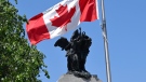 The Canadian flag flies above the National War Memorial in Ottawa, on Canadian Armed Forces Day, June 4, 2023. THE CANADIAN PRESS/Justin Tang