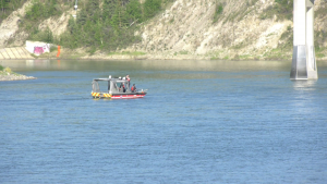 Emergency responders search for a 14-year-old swimmer who was swept away by a current in the North Saskatchewan River near Edmonton's Terwillegar Park on Sunday, June 4, 2023. 