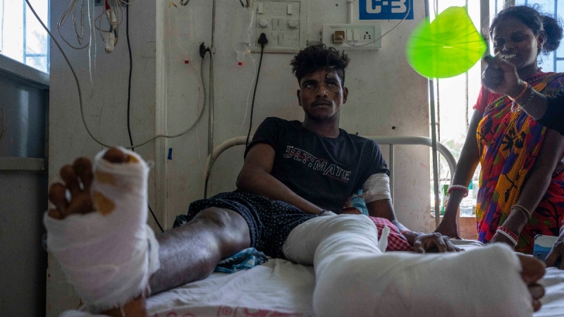 Gura Pallay, 24, who was onboard one of the two passenger trains that crashed June 2, 2023, receives treatment at a hospital in Balasore district, in the eastern state of Orissa, India, June 4, 2023. (AP Photo/Rafiq Maqbool)